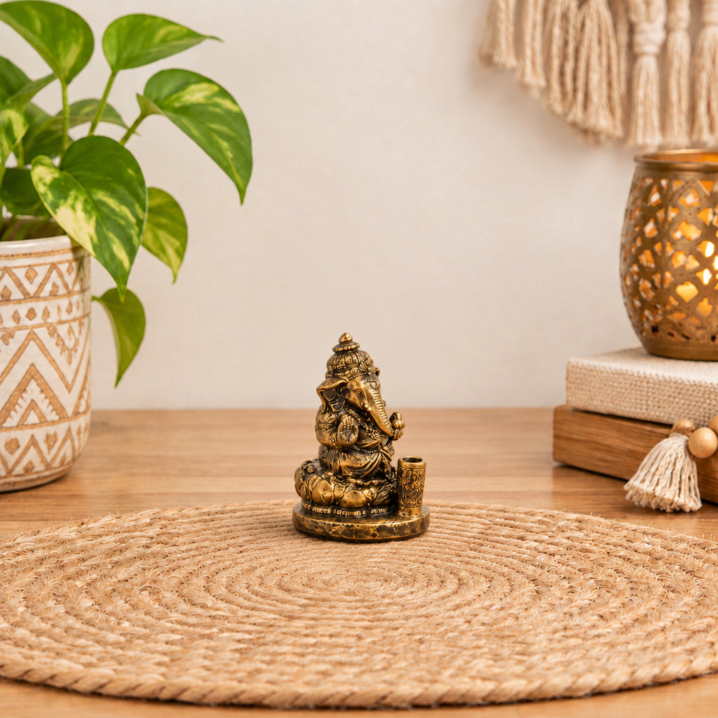 Ganesh incense stick holder with an antique brass finish.