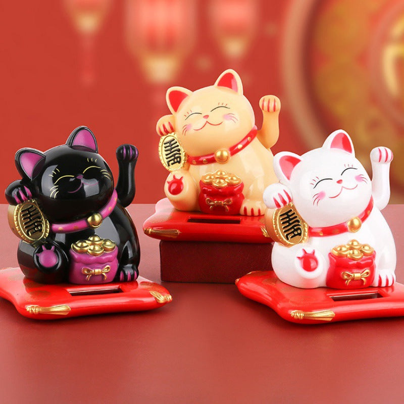 Waving lucky cats solar powered