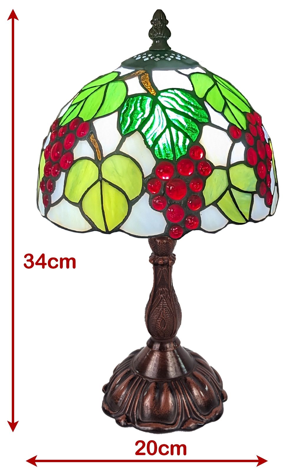 A stained glass table lamp with a grapevine design, featuring green leaves, red grapes, and a dark bronze metal base. Red dimension arrows indicate a height of 34cm and a width of 20cm.