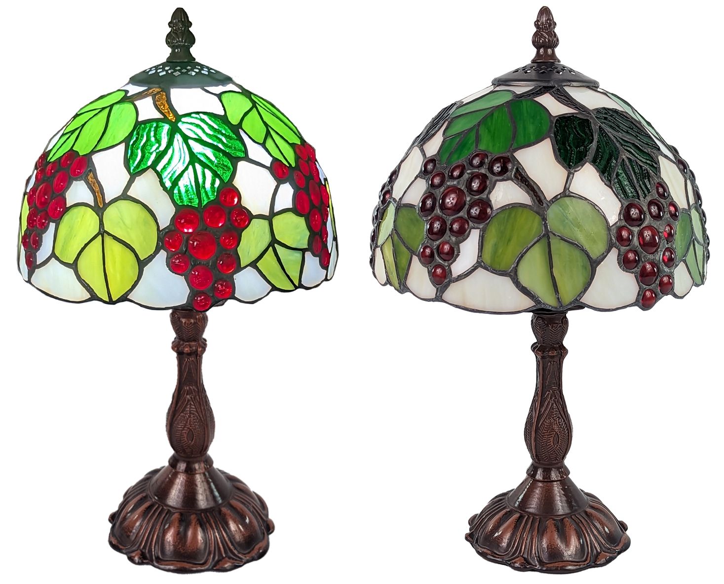 Two matching stained glass table lamps with grapevine designs, featuring green leaves, red grape clusters, and an antique bronze metal base on a white background.