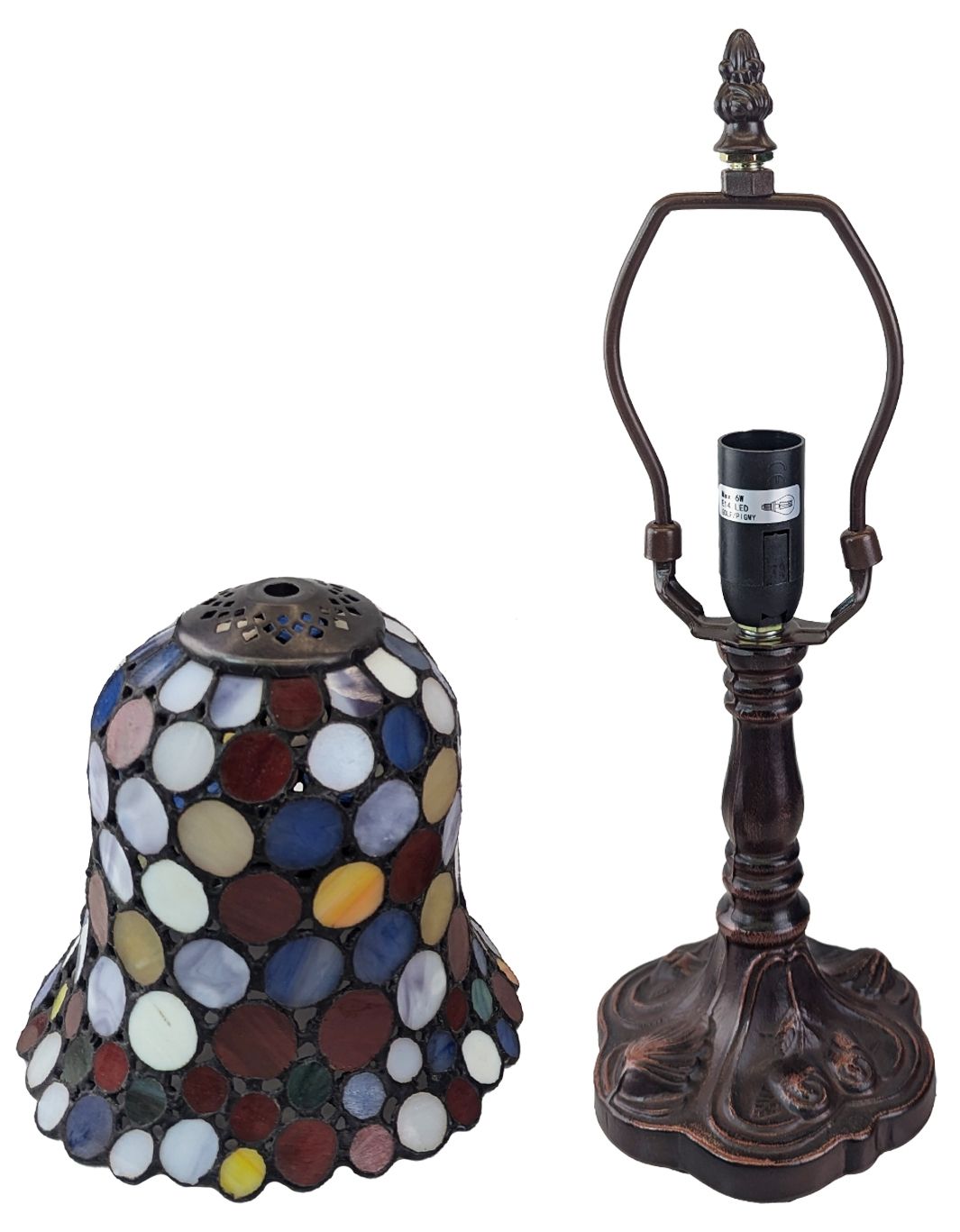 A Tiffany-style stained glass table lamp shade and matching metal lamp base shown on a plain white background.