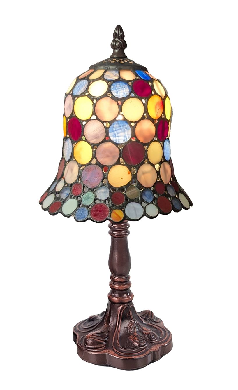 A Tiffany-style stained glass table lamp with a bell-shaped shade made of colorful circular glass panels in yellow, red, blue, green, and orange, mounted on an ornate dark bronze-finished metal base.