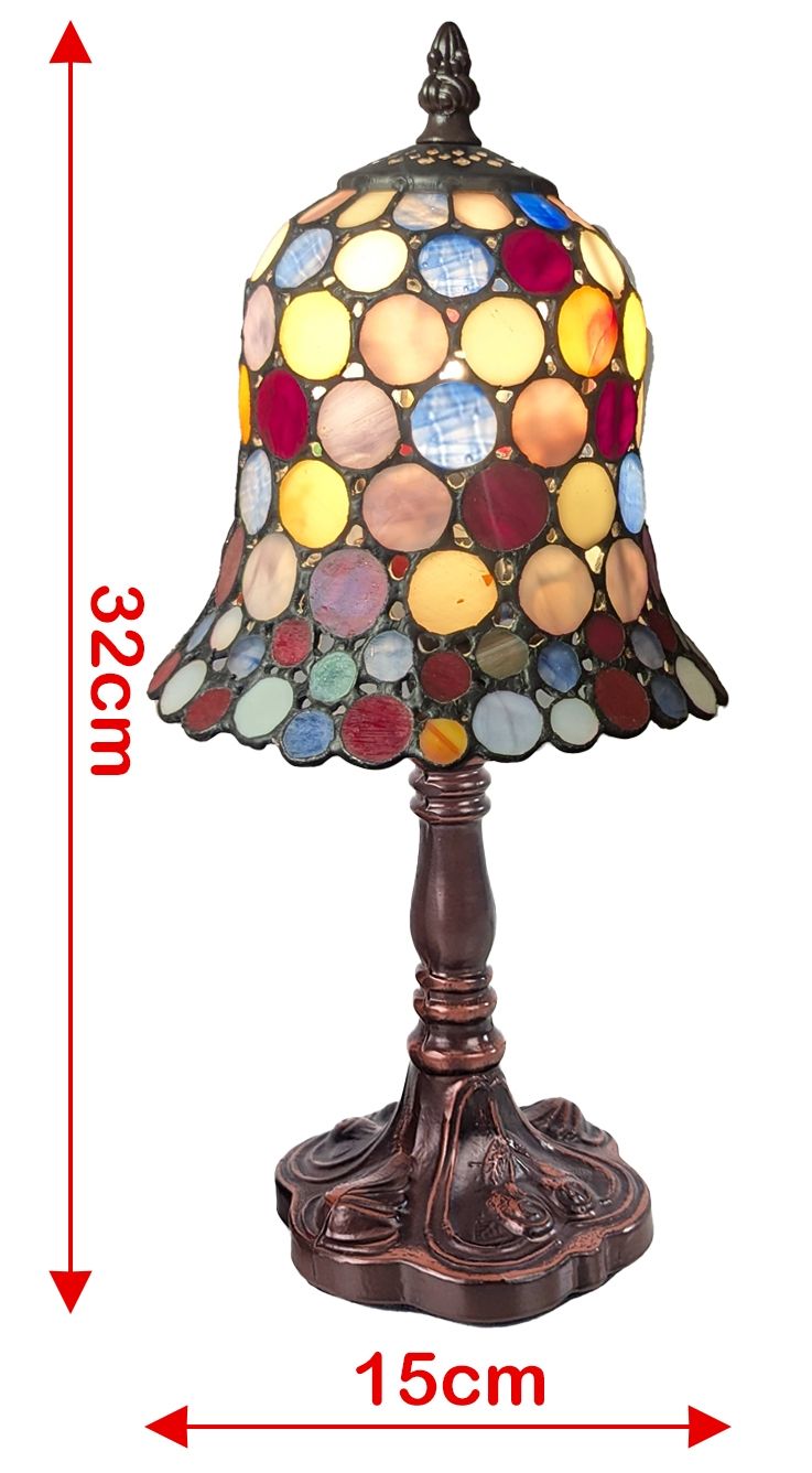 A stained glass table lamp with a multicolor circular shade and a dark bronze base, shown on a white background with red dimension arrows and text indicating 32 cm height and 15 cm width.