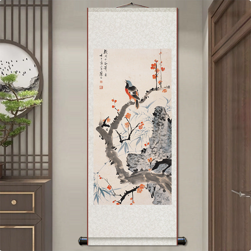 Traditional Chinese scroll painting of birds and flowers on a wall