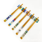 Set of chopsticks with decorative handles on a white background