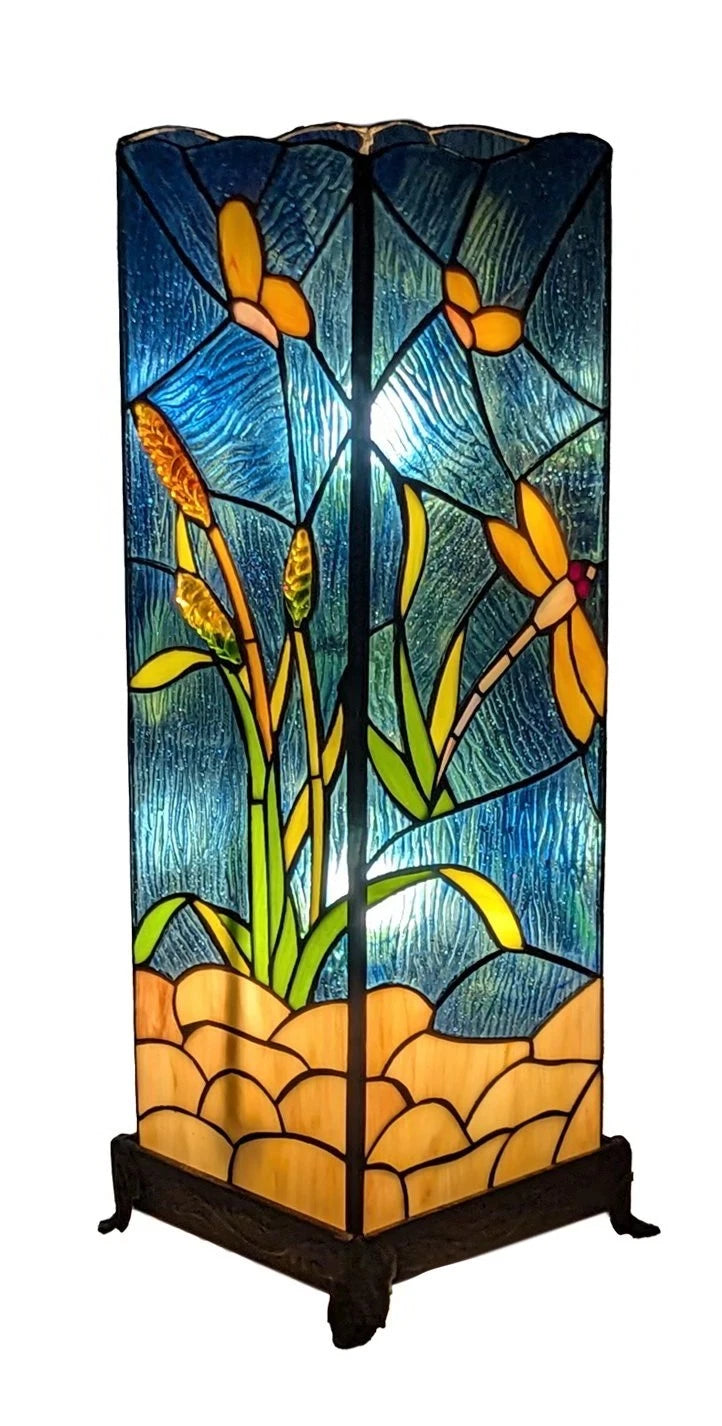 Decorative stained glass lamp with floral design on a white background