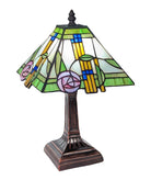 A Tiffany style pyramid table lamp with a multicolored stained glass shade and a dark metal base, resembling the art style of Mackintosh.