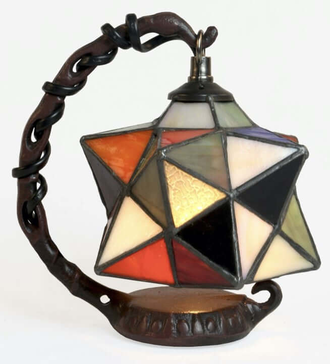 A multi-coloured 3D star-shaped stained glass lamp shade with a brown base and hanging cable.