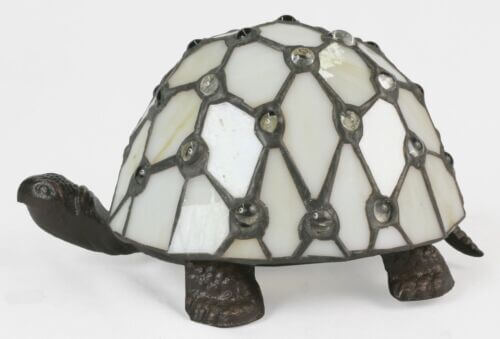 Unlit tortoise design Tiffany table lamp showing cream stained glass shell and dark metal legs