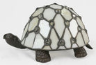 Unlit tortoise design Tiffany table lamp showing cream stained glass shell and dark metal legs